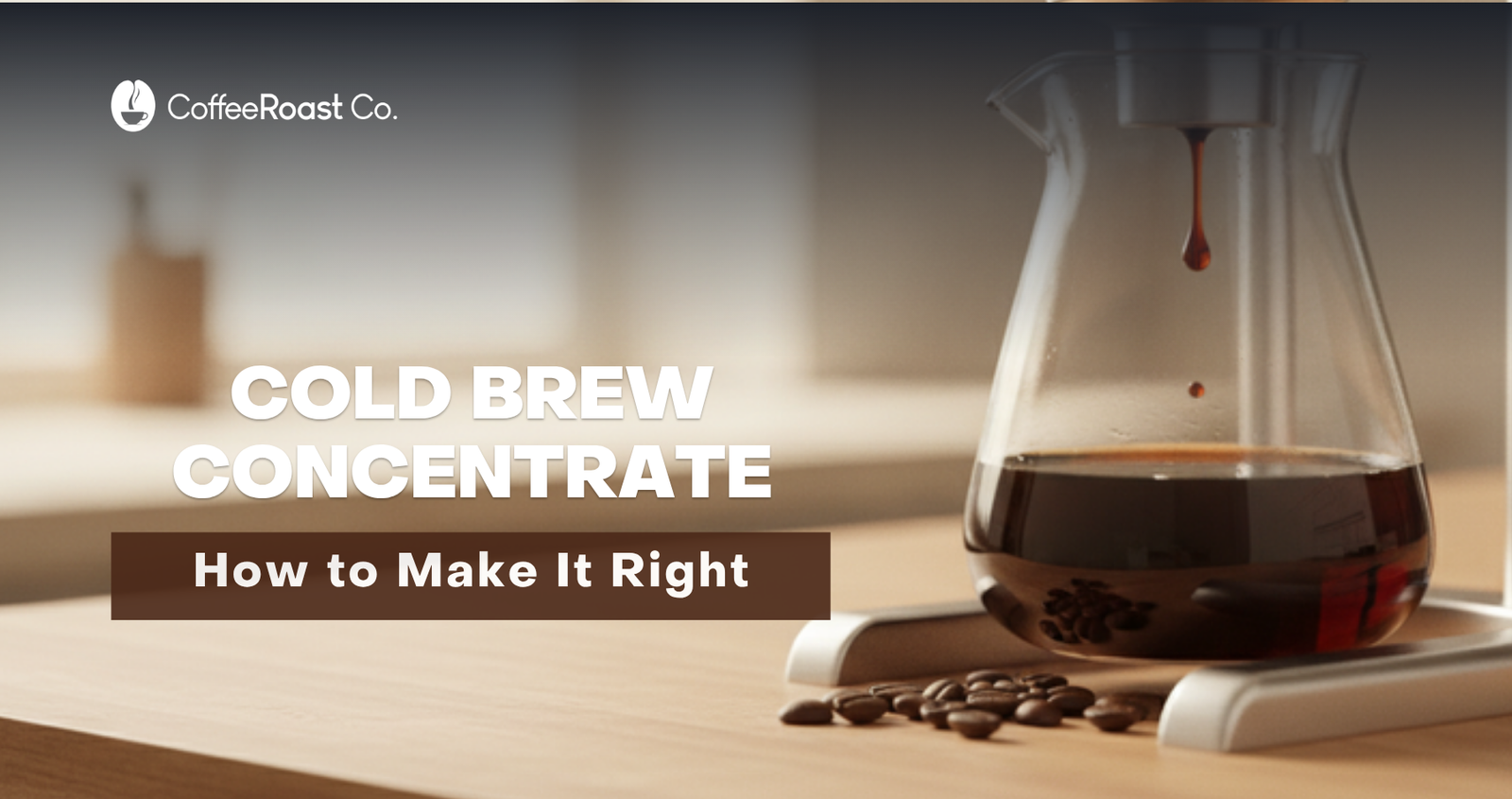 Cold-drip coffee tower dripping dark coffee concentrate into a glass carafe, coffee beans scattered on a warm wood counter — CoffeeRoast Co. cold brew concentrate guide hero.